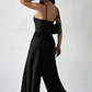 Jumpsuit mit Spaghettiträgern, weitem Bein und Taschen